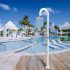 Luxury,Resort,With,Swimming,Pool,Near,Palm,Beach,Aruba,Caribbean
